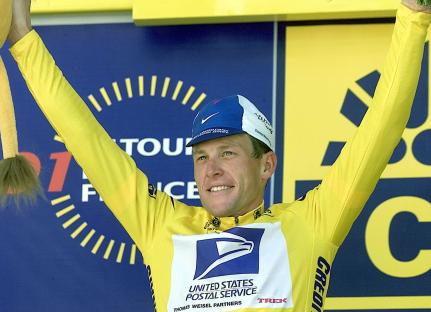 Lance Armstrong in yellow jersey, celebrating Tour de France victory.