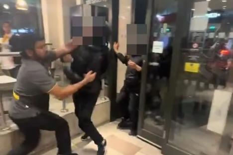 Moment McDonald’s worker SLAPS yob across head before brawl breaks out as group storm restaurant & punters cower in fear