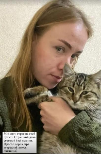 Ukraine frontline medic holding a cat.