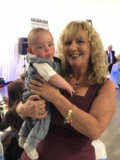 Woman holding a baby.