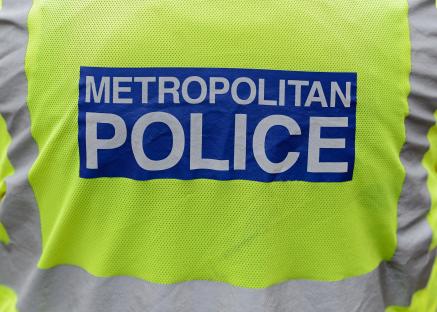 Close-up of a Metropolitan Police officer's back.