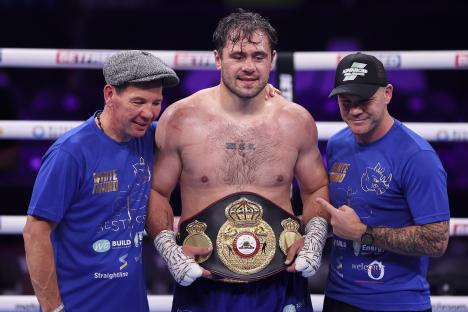 Boxer Dave Allen with his team and championship belt.