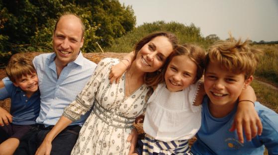 Photo of the Prince and Princess of Wales with their three children.