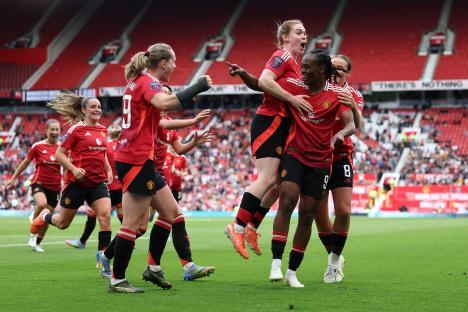 Manchester United women's soccer team celebrating a goal.