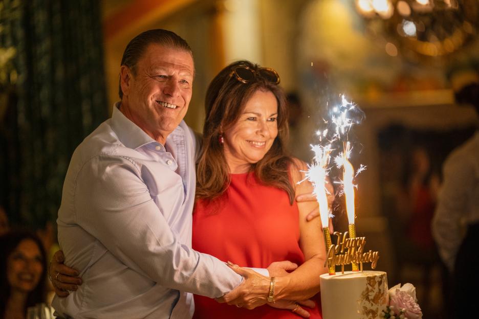 Sean Bean and Julie Graham at an anniversary celebration with a cake.